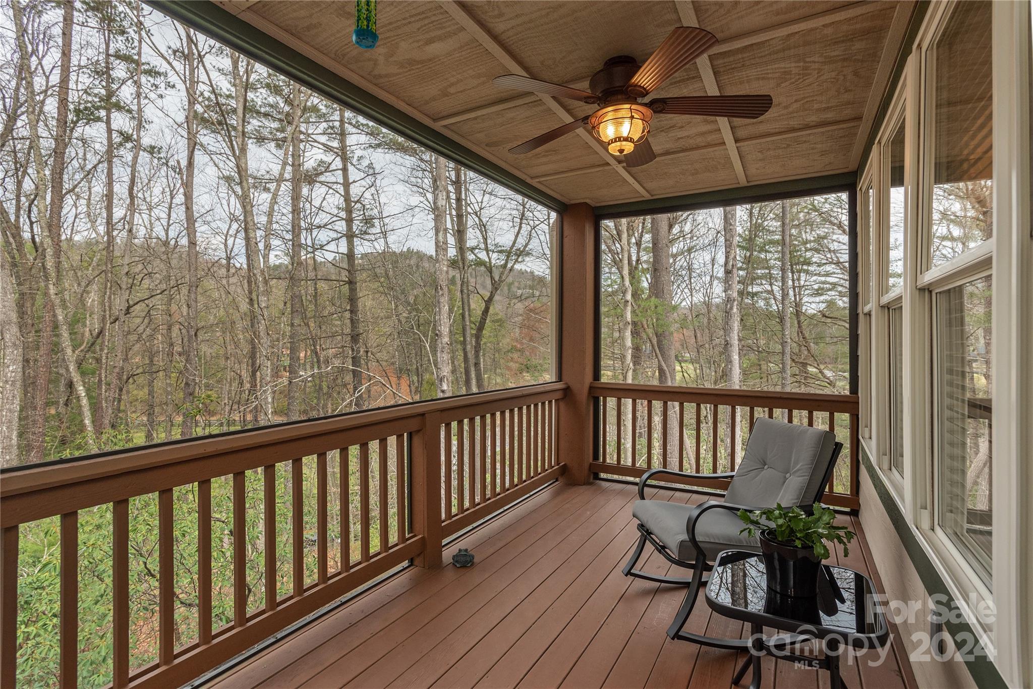 99 Ridgetop Circle, Unit 203 Brevard, NC 28712 - Photo 10 of 36 a view of a two chairs in the balcony