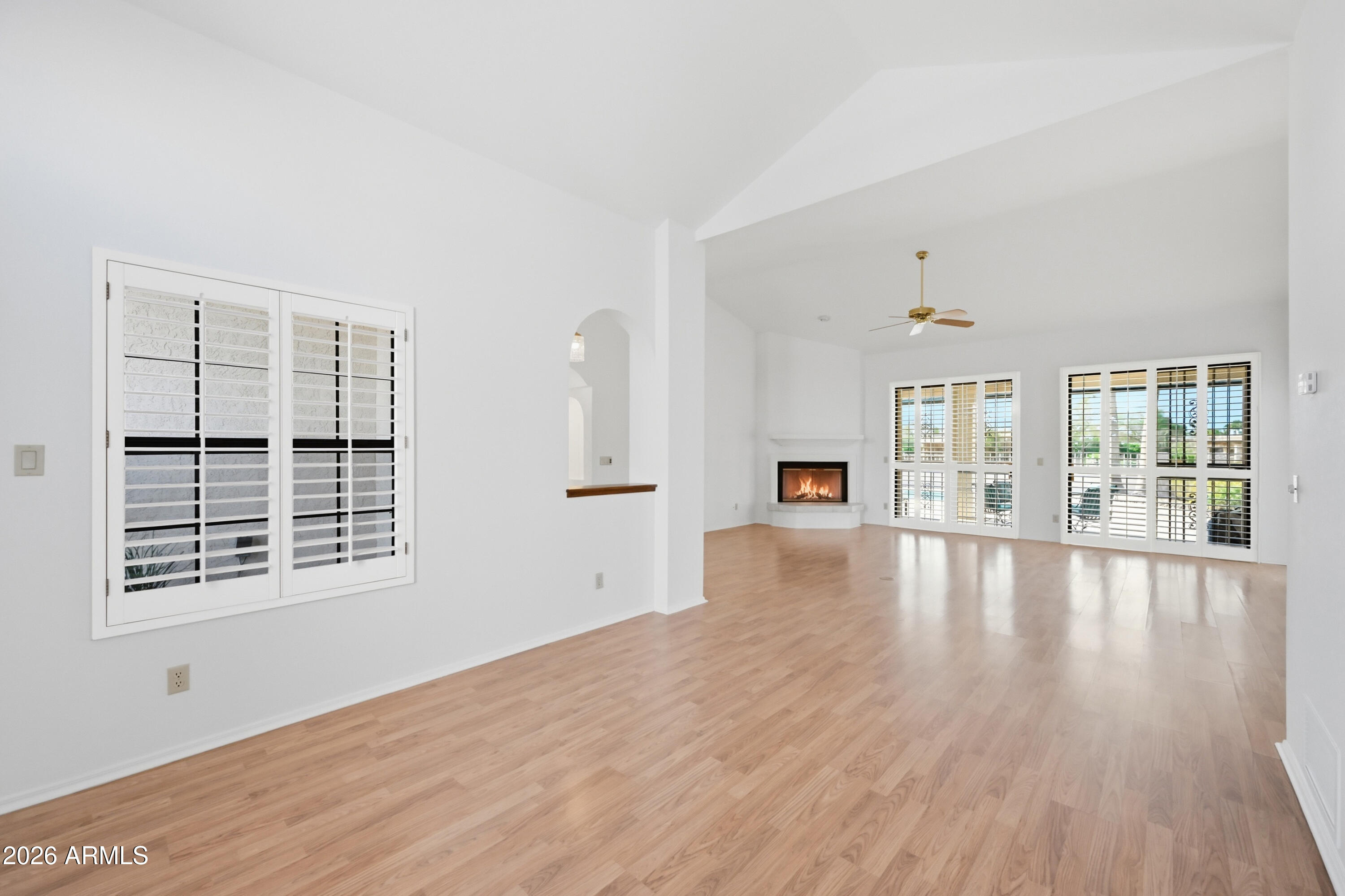19113 East Vía Esquina Rio Verde, AZ 85263 - Photo 10 of 44 a view of an empty room with wooden floor and a window