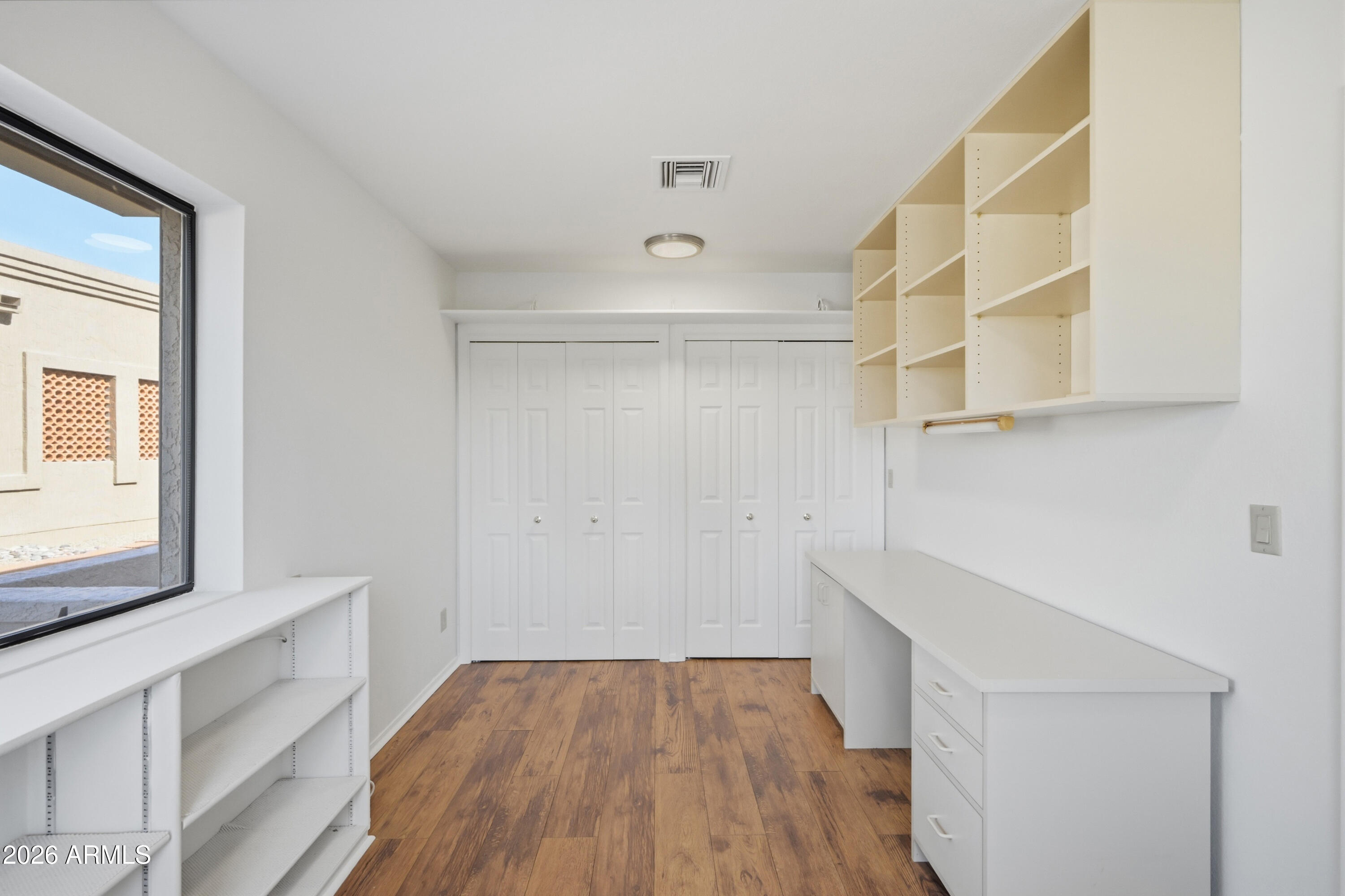 19113 East Vía Esquina Rio Verde, AZ 85263 - Photo 15 of 44 a view of hallway with a large window and wooden floor