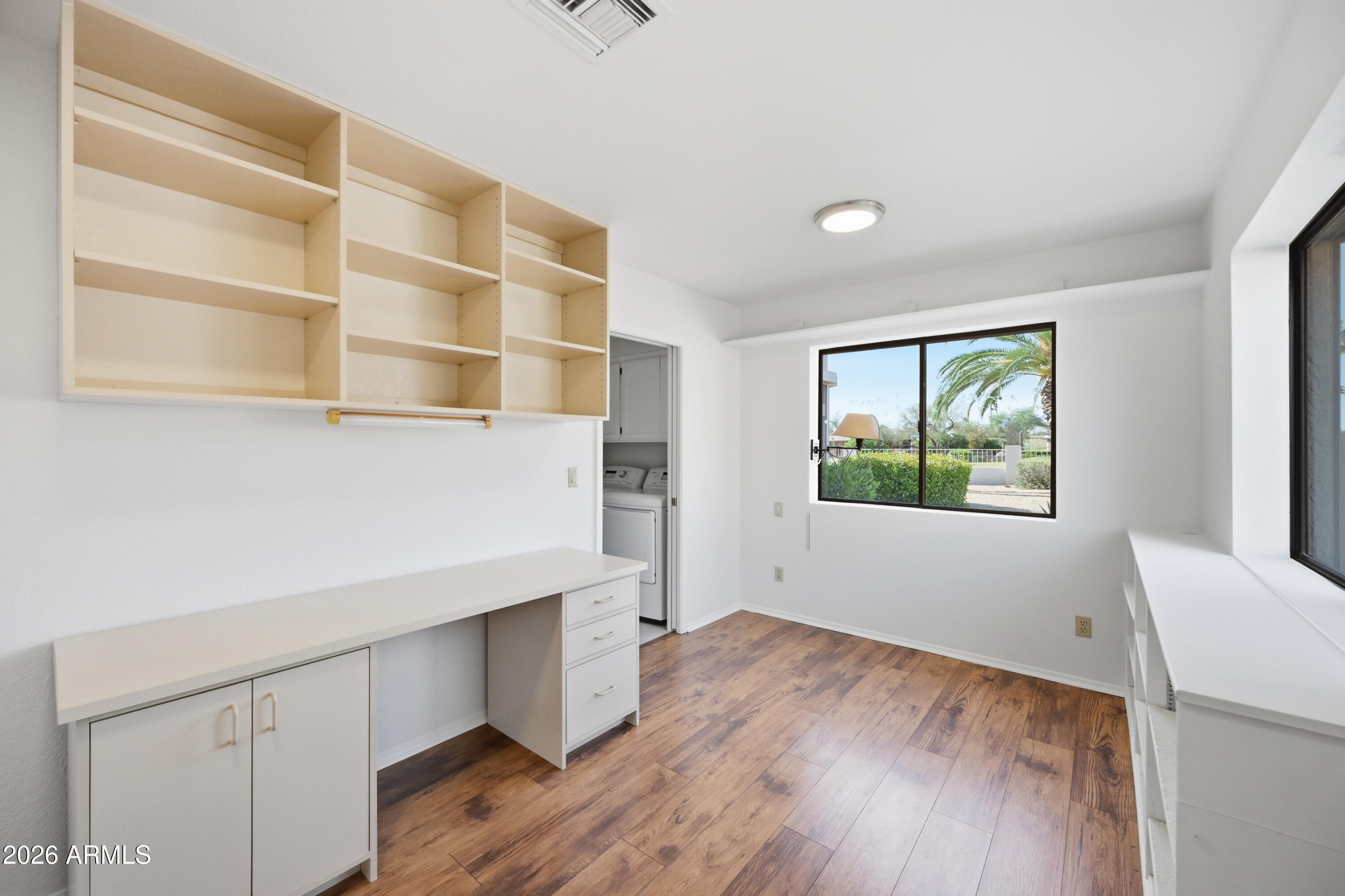 19113 East Vía Esquina Rio Verde, AZ 85263 - Photo 16 of 44 a view of an empty room with wooden floor and a window