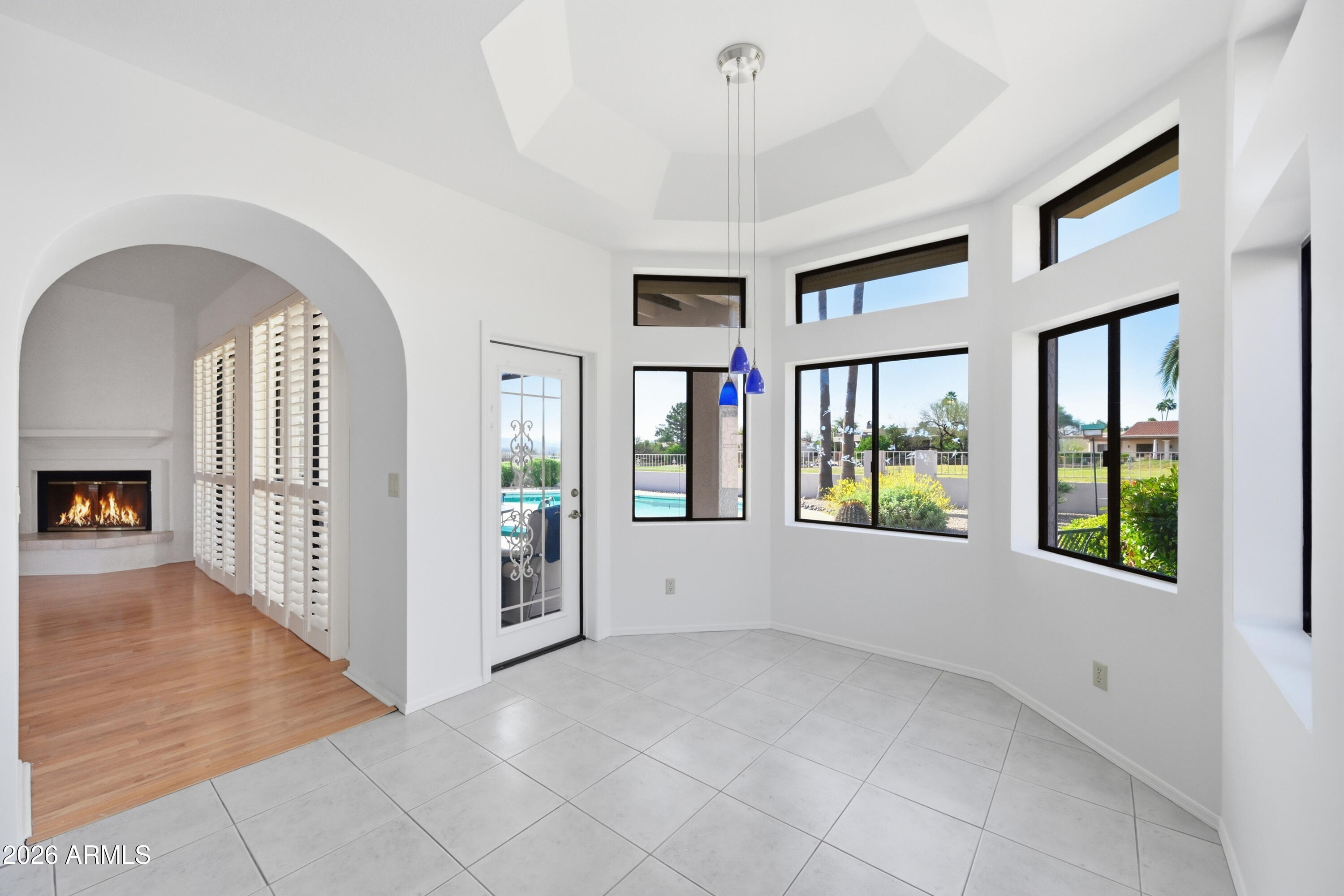 19113 East Vía Esquina Rio Verde, AZ 85263 - Photo 17 of 44 an empty room with windows and chandelier