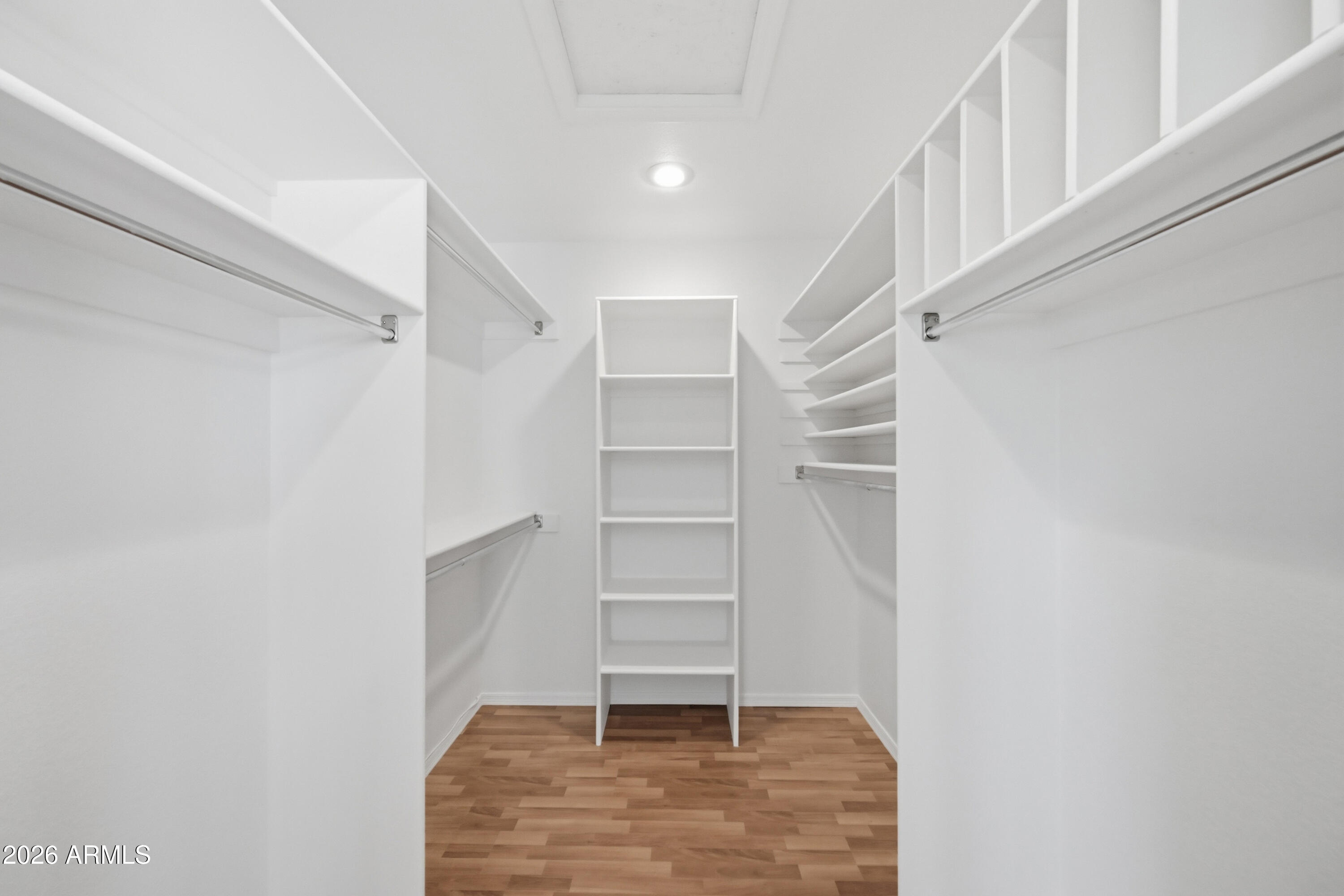 19113 East Vía Esquina Rio Verde, AZ 85263 - Photo 22 of 44 a view of walk in closet with empty racks