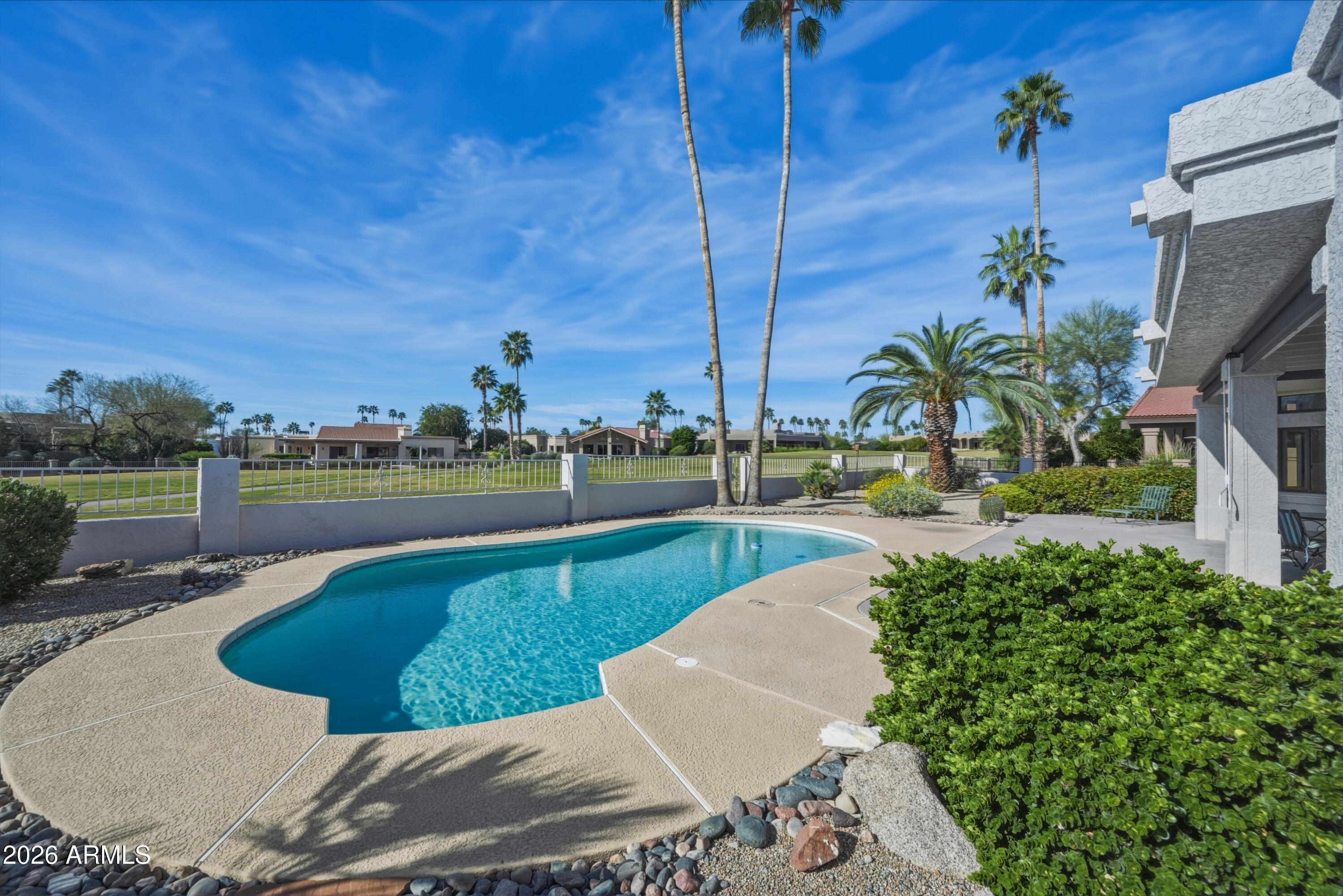 19113 East Vía Esquina Rio Verde, AZ 85263 - Photo 33 of 44 a view of a swimming pool with a lawn chairs and a fire pit