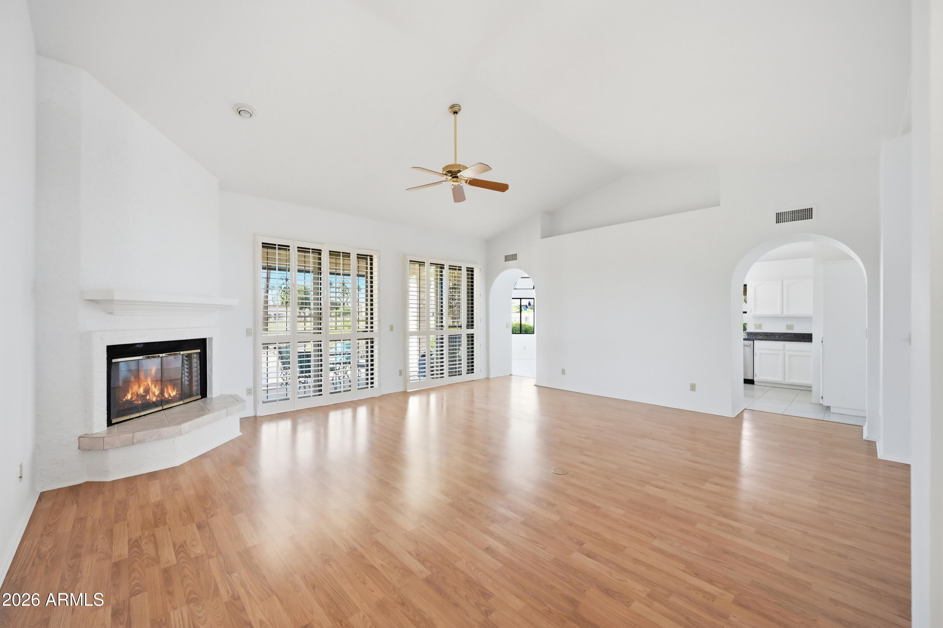 19113 East Vía Esquina Rio Verde, AZ 85263 - Photo 6 of 44 wooden floor in an empty room with a window
