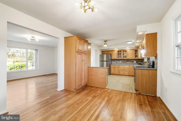 a view of kitchen with cabinets and wooden floor