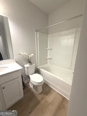 a bathroom with a toilet a sink and a bathtub