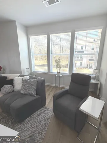 a living room with furniture and a window