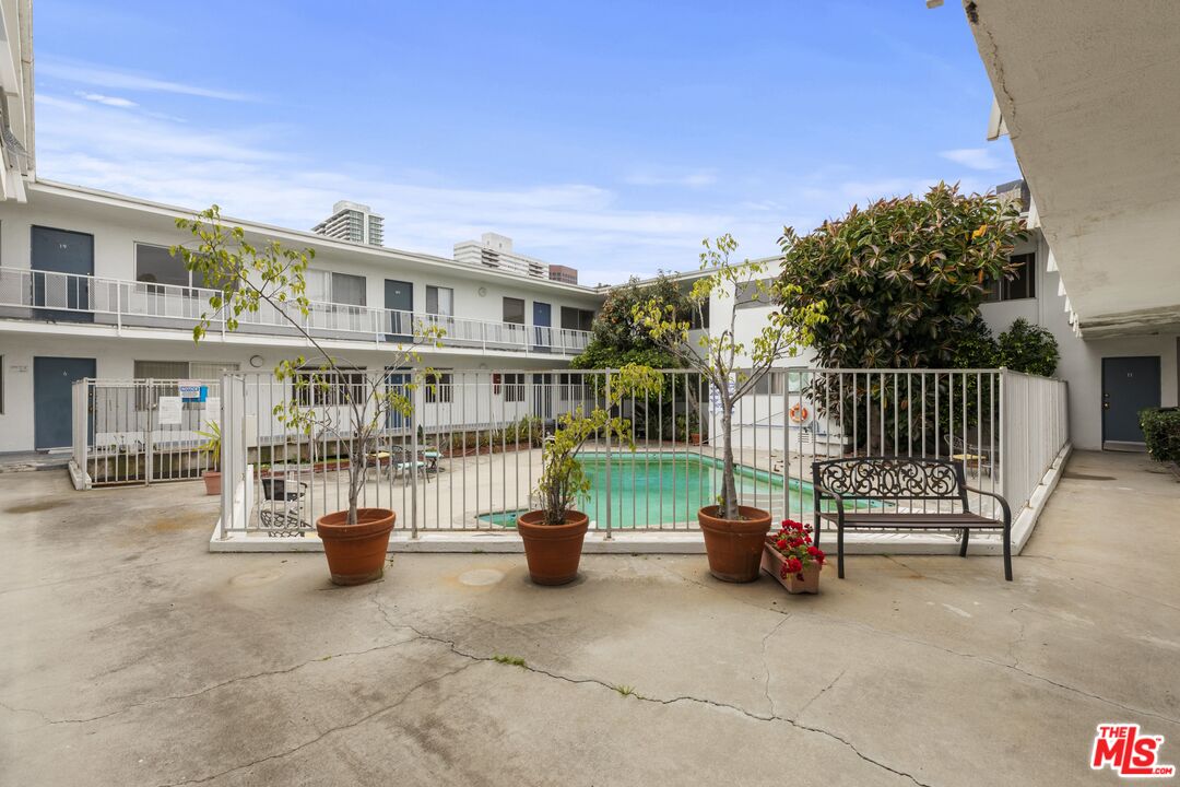 1295 Federal Avenue, Unit 3 Los Angeles, CA 90025 - Photo 12 of 12 a view of a patio with a table and chairs