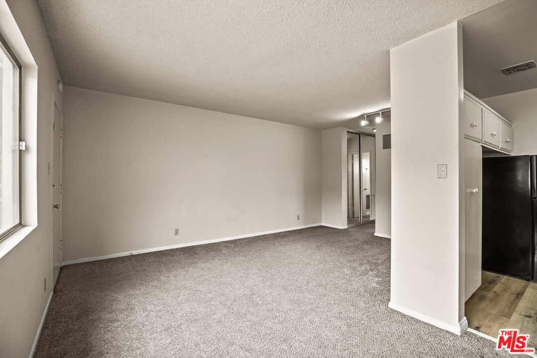 1295 Federal Avenue, Unit 3 Los Angeles, CA 90025 - Photo 4 of 12 an empty room with windows