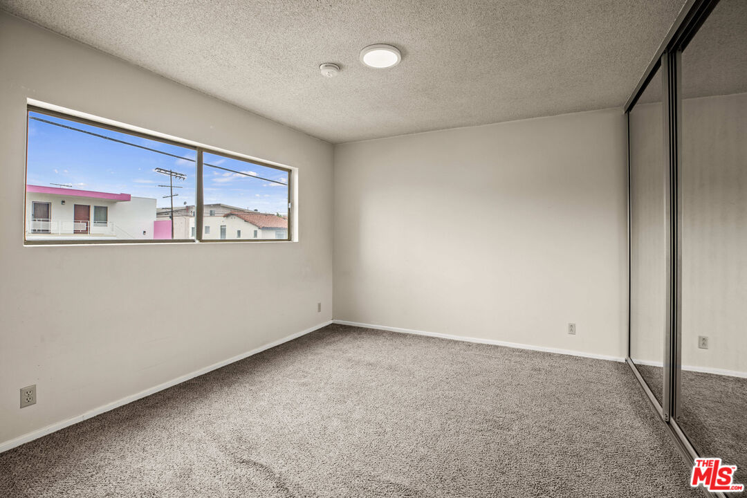 1295 Federal Avenue, Unit 3 Los Angeles, CA 90025 - Photo 6 of 12 a view of an empty room with a window