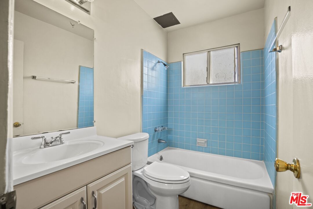 1295 Federal Avenue, Unit 3 Los Angeles, CA 90025 - Photo 8 of 12 a bathroom with a sink toilet and shower