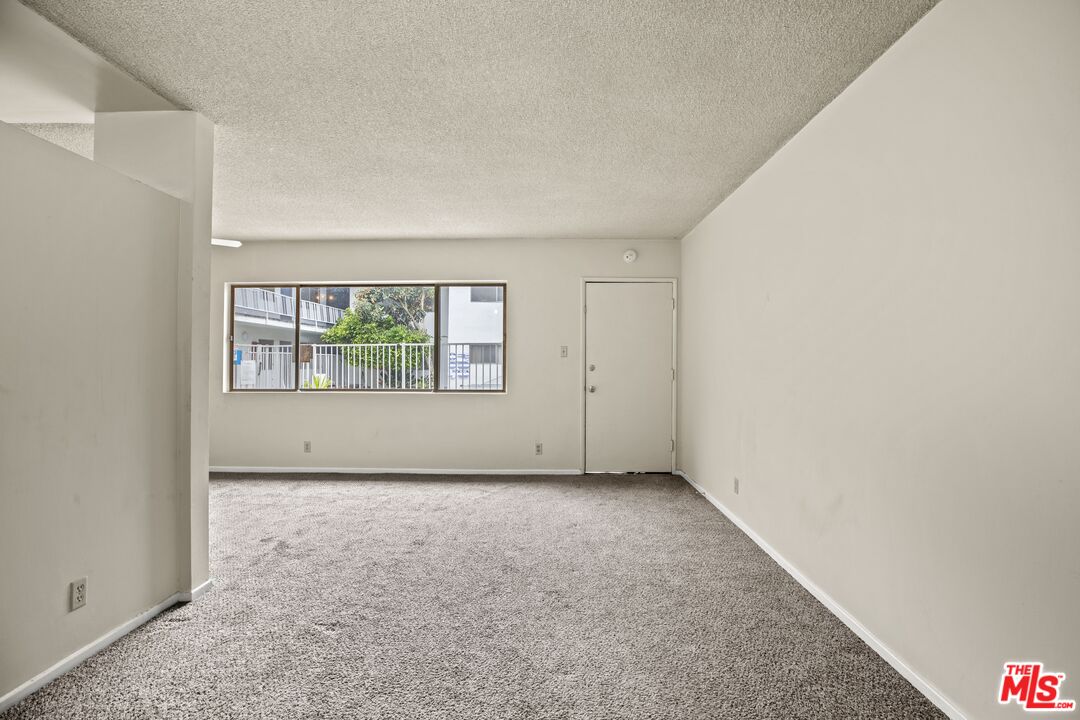 1295 Federal Avenue, Unit 3 Los Angeles, CA 90025 - Photo 9 of 12 an empty room with windows