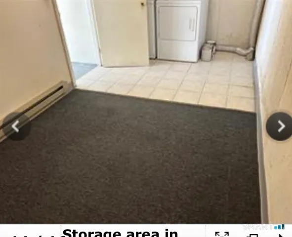 a view of an empty room and a window