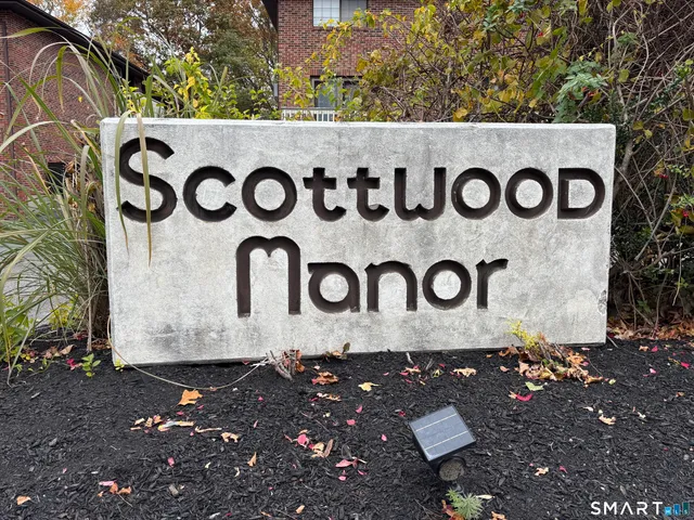 a wooden sign sign on a wall