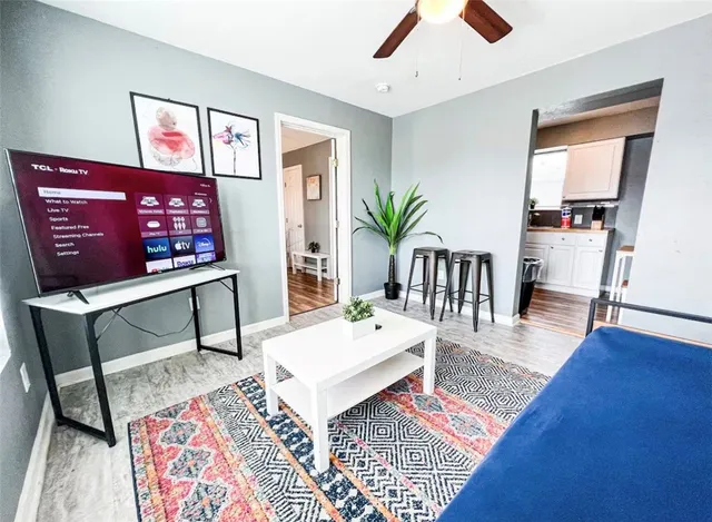 a living room with furniture and a table