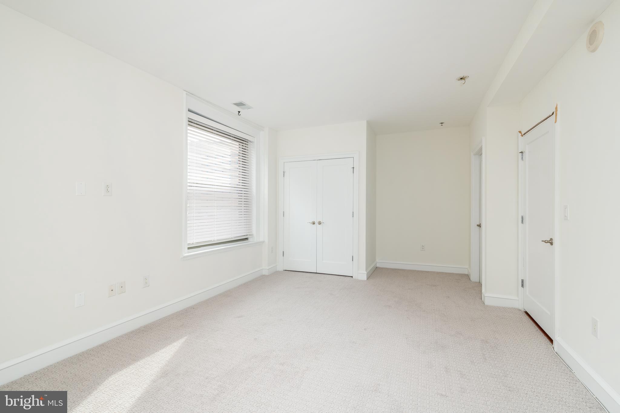 1811 Chestnut Street, Unit 707 Philadelphia, PA 19103 - Photo 11 of 39 a view of an empty room with a window