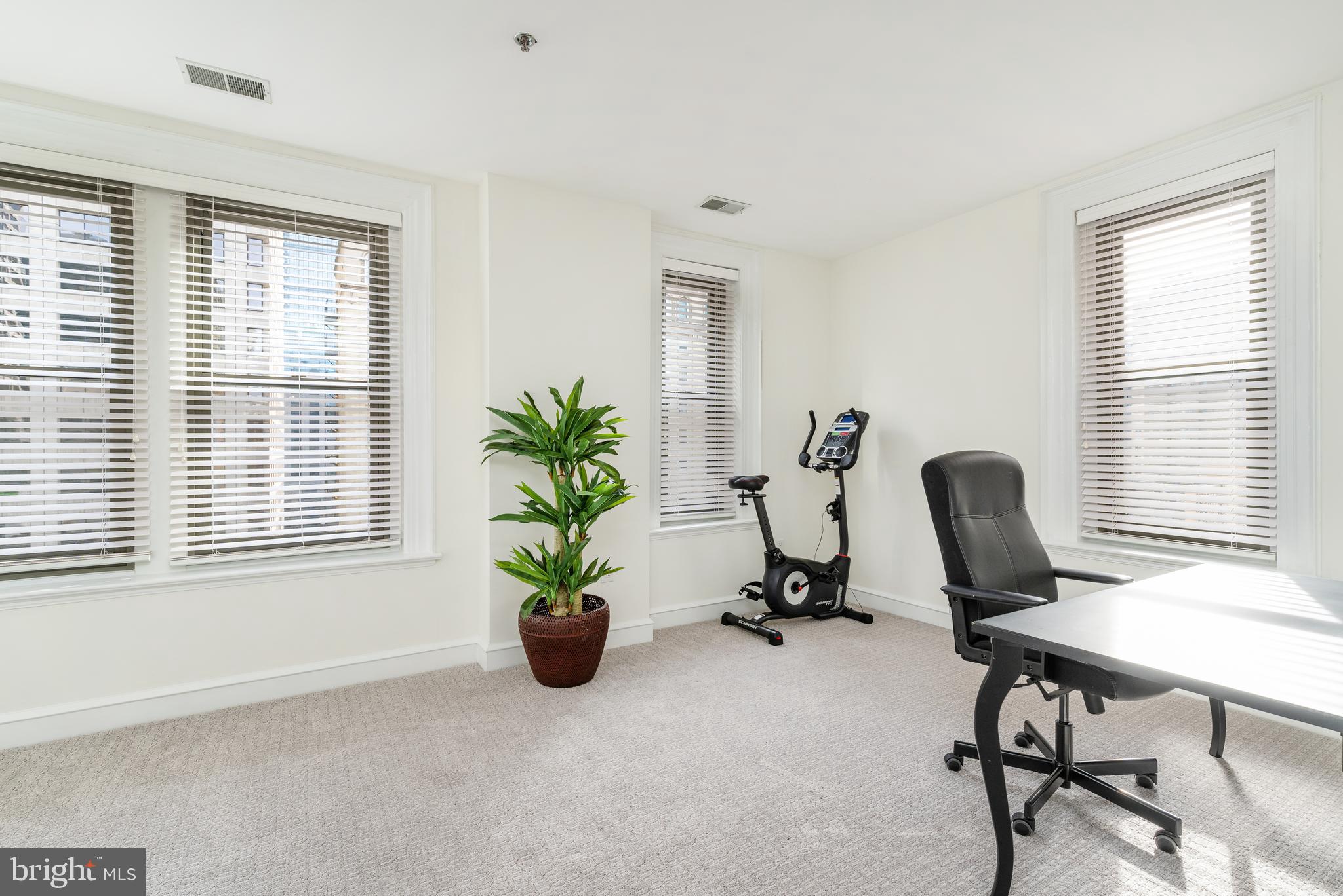 1811 Chestnut Street, Unit 707 Philadelphia, PA 19103 - Photo 15 of 39 a view of a workspace with furniture and a window