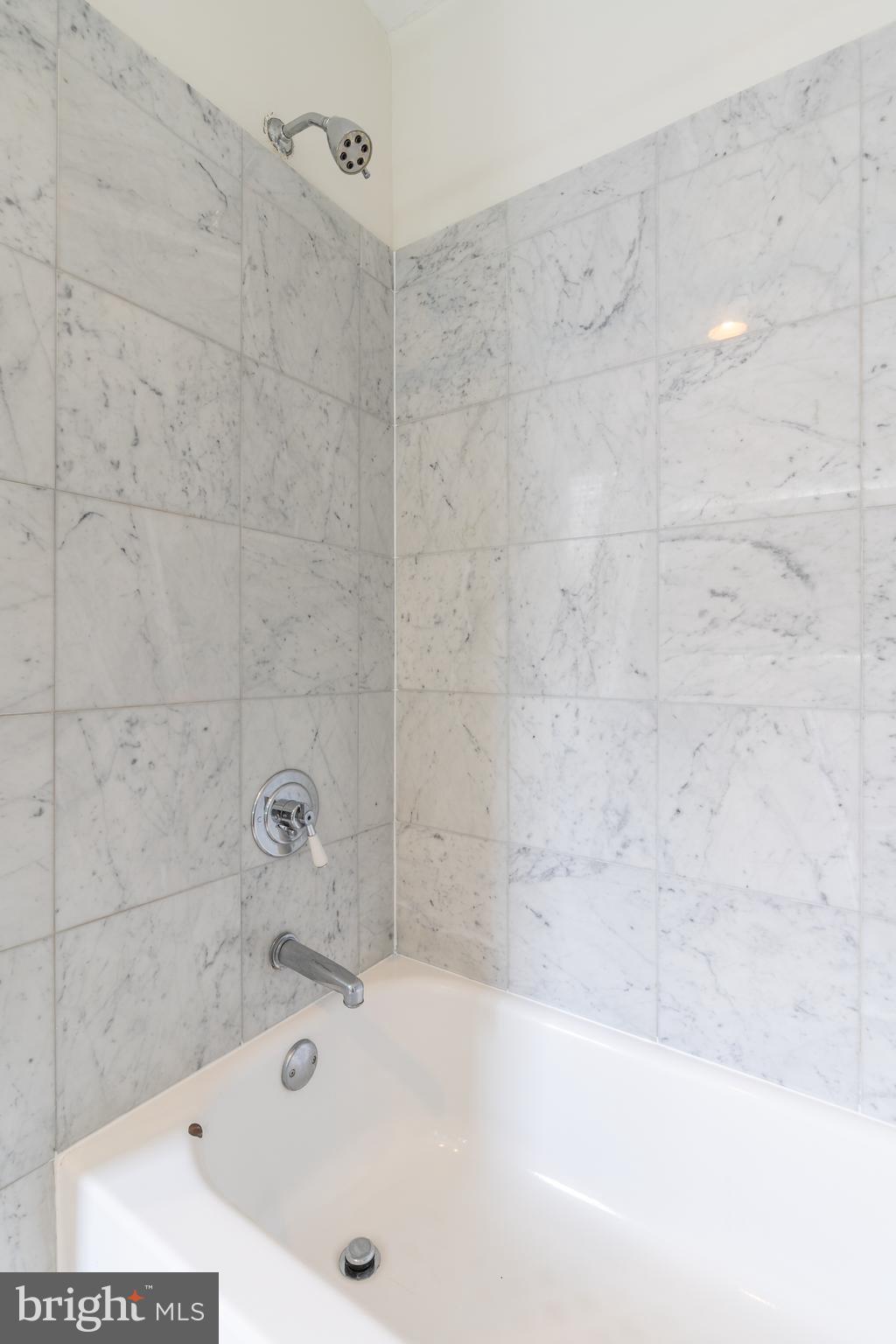 1811 Chestnut Street, Unit 707 Philadelphia, PA 19103 - Photo 20 of 39 a bathroom with a bathtub and a shower