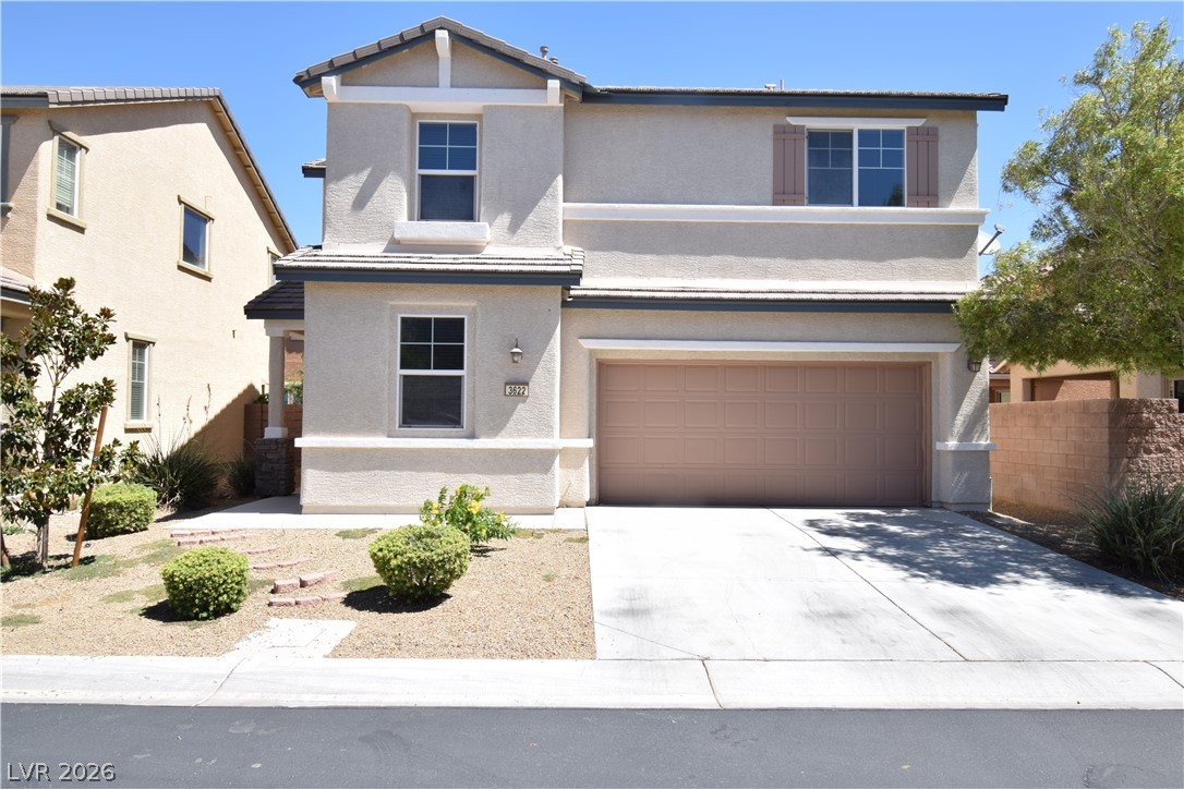 3622 Via Terracina Henderson, NV 89052 - Photo 1 of 22 A well-maintained two-story stucco residence featuring a practical concrete driveway and an inviting desert-style landscape.