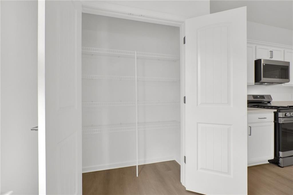 111 Weston Way Northwest Cartersville, GA 30121 - Photo 13 of 41 a view of a kitchen with an empty space and a window