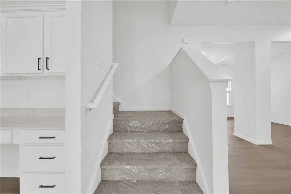 111 Weston Way Northwest Cartersville, GA 30121 - Photo 21 of 41 a view of staircase with white walls