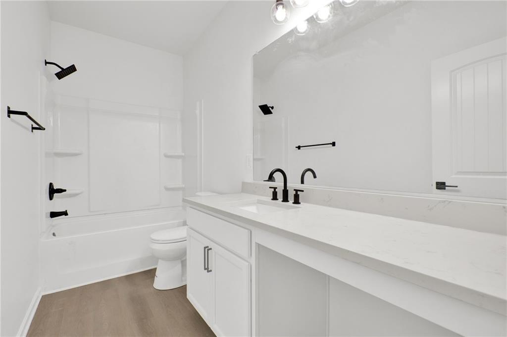 111 Weston Way Northwest Cartersville, GA 30121 - Photo 30 of 41 a bathroom with a sink a toilet and shower