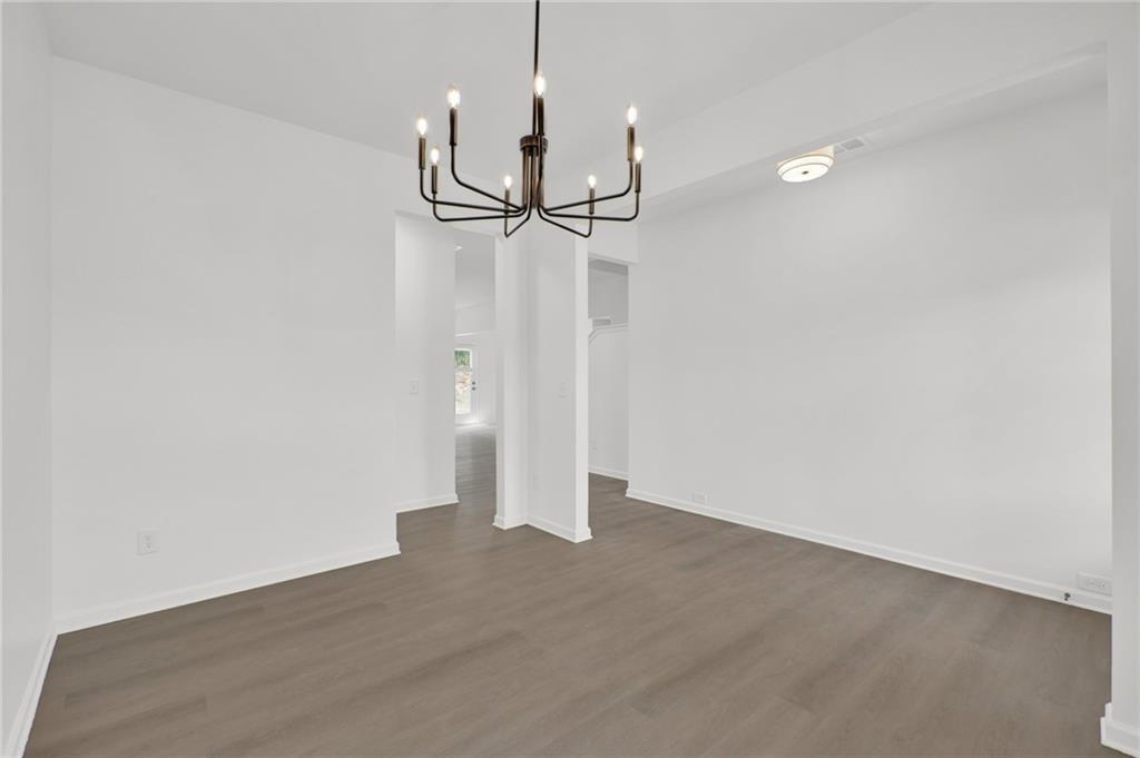 111 Weston Way Northwest Cartersville, GA 30121 - Photo 6 of 41 a view of a room with wooden floor and a ceiling fan