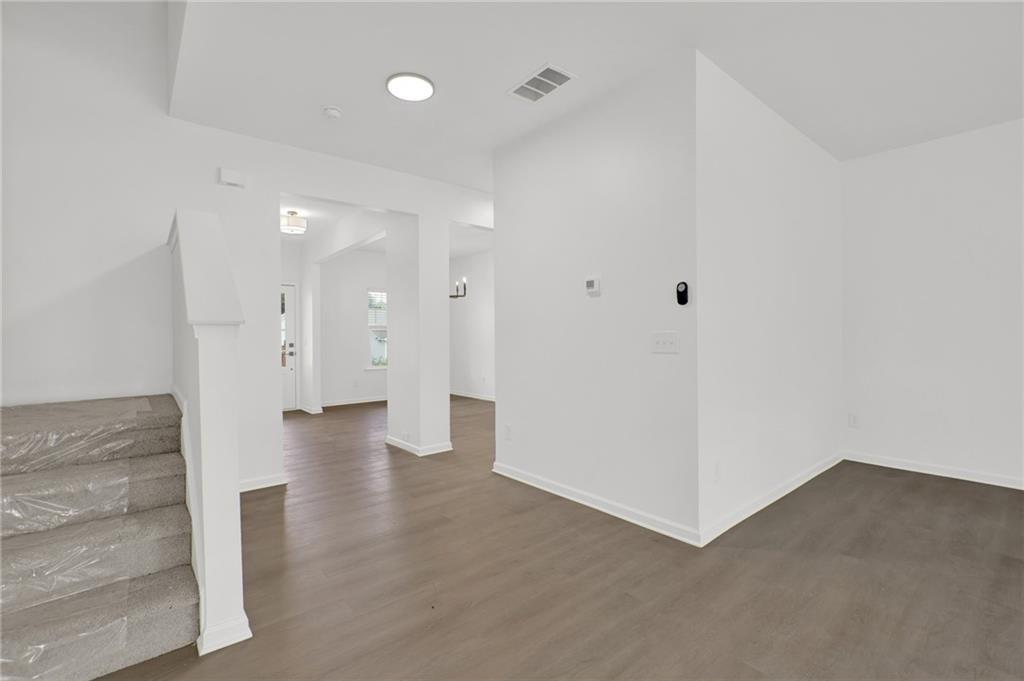 111 Weston Way Northwest Cartersville, GA 30121 - Photo 8 of 41 a view of a hallway with wooden floor