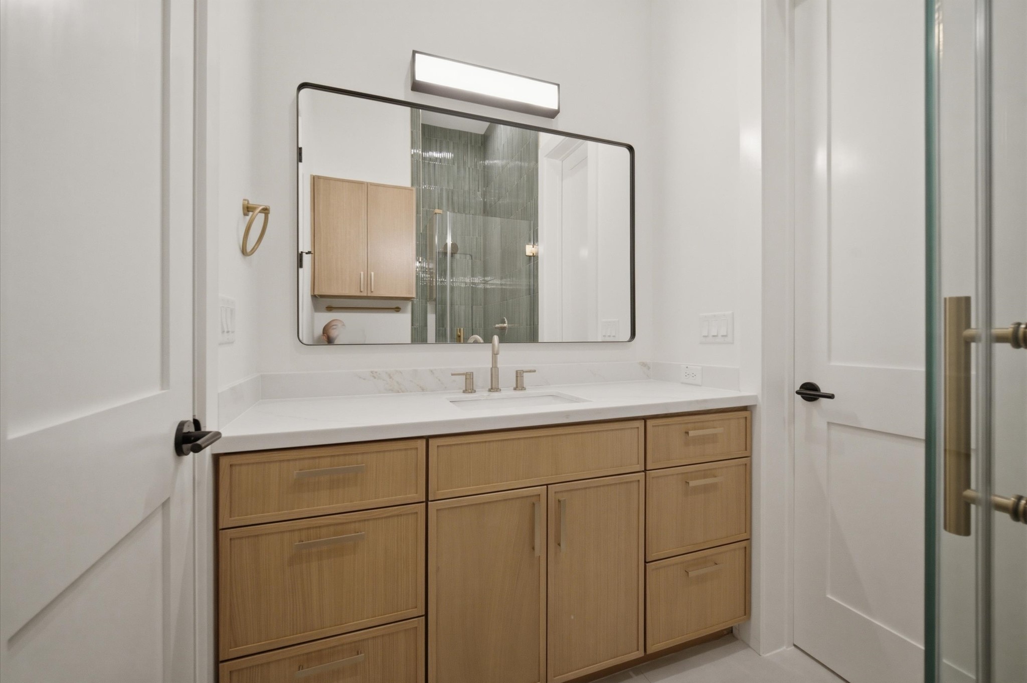 112 East 27th Street Houston, TX 77008 - Photo 15 of 43 Bathroom vanity with quartz countertops and white oak cabinetry.