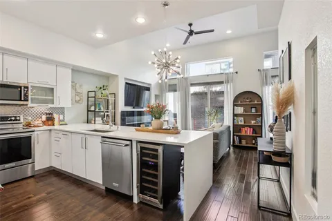 a kitchen with stainless steel appliances granite countertop a stove and cabinets