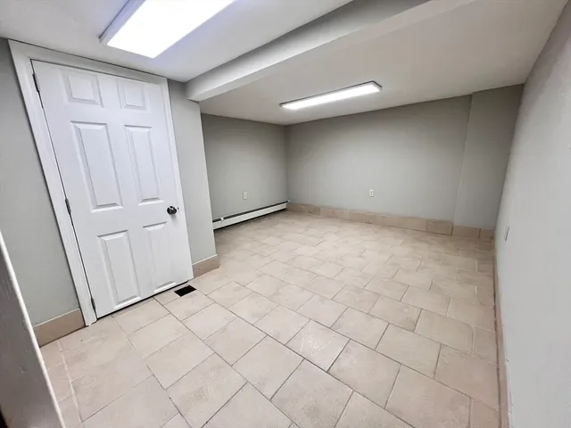 an empty room with a bathroom