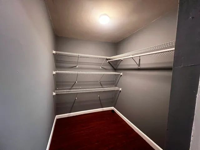 a view of storage and utility room with racks on the wall