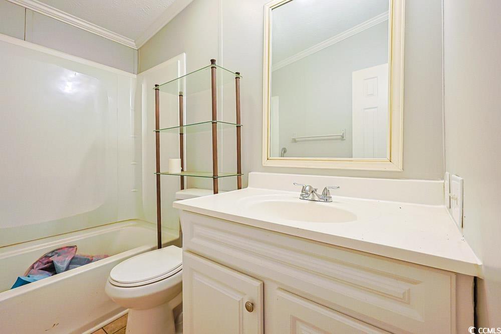 175 Darlene Drive Myrtle Beach, SC 29588 - Photo 20 of 31 Full bathroom featuring vanity, crown molding, and shower / tub combination