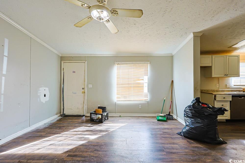 175 Darlene Drive Myrtle Beach, SC 29588 - Photo 6 of 31 Foyer with a textured ceiling, crown molding, dark wood-style flooring, and ceiling fan