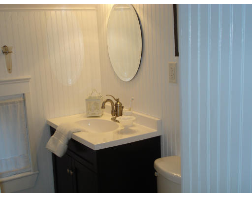 72 Turner Road Scituate, MA 02066 - Photo 8 of 10 a bathroom with a sink vanity and a mirror