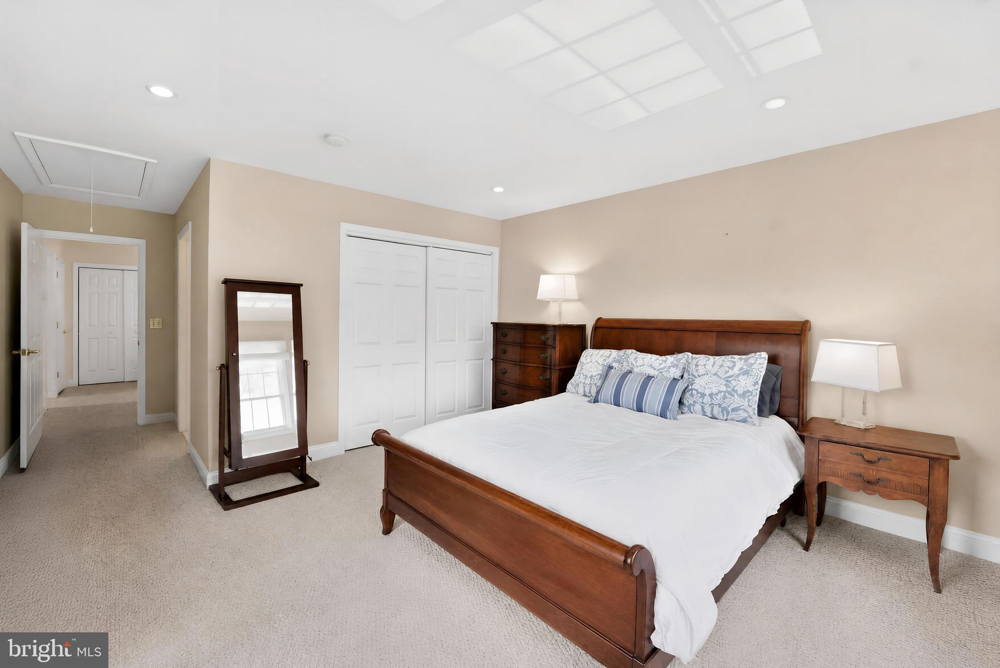 6 Hedge Row Road Princeton, NJ 08540 - Photo 26 of 32 a large bed sitting in a bedroom and a table