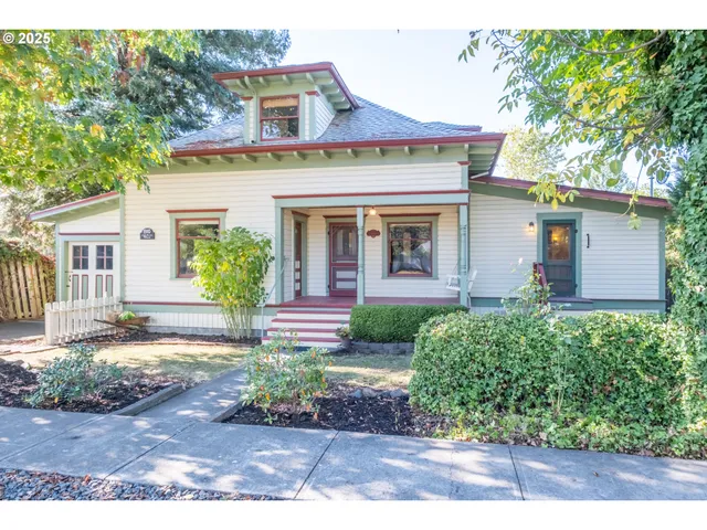 a front view of a house with garden