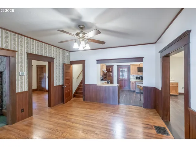 a view of livingroom with furniture wooden floor and chandelier
