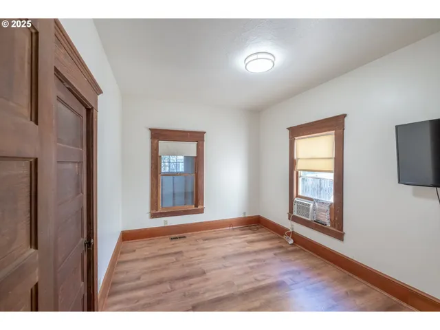 a view of a kitchen with furniture and cabinets