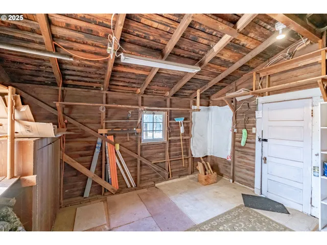 a view of a porch with wooden floor and roof