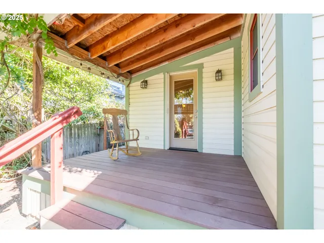 a backyard of a house with barbeque oven