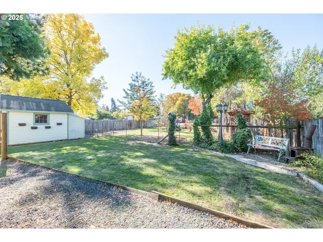 a front view of a house with garden and patio
