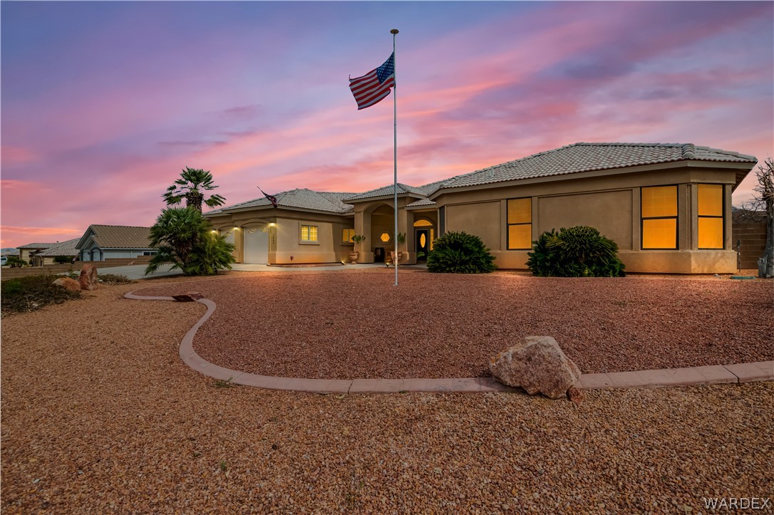 2898 Mountain Trail Road Kingman, AZ 86401 - Photo 31 of 75 a front view of a house with a yard