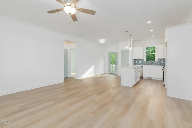 a view of kitchen with sink and window