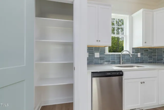 a kitchen with a sink and cabinets