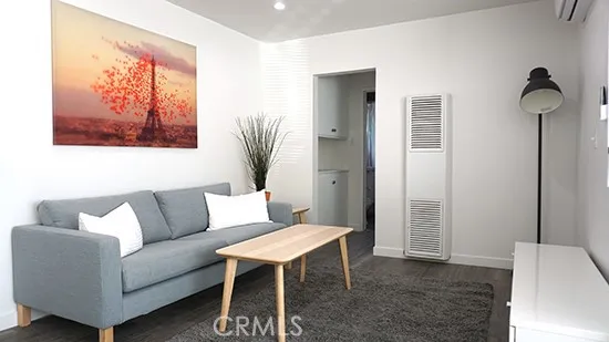 a living room with furniture and a rug