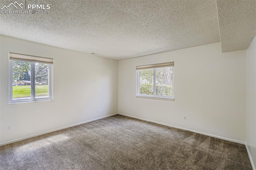 850 Tenderfoot Hill Road, Unit 103 Colorado Springs, CO 80906 - Photo 20 of 20 an empty room with windows