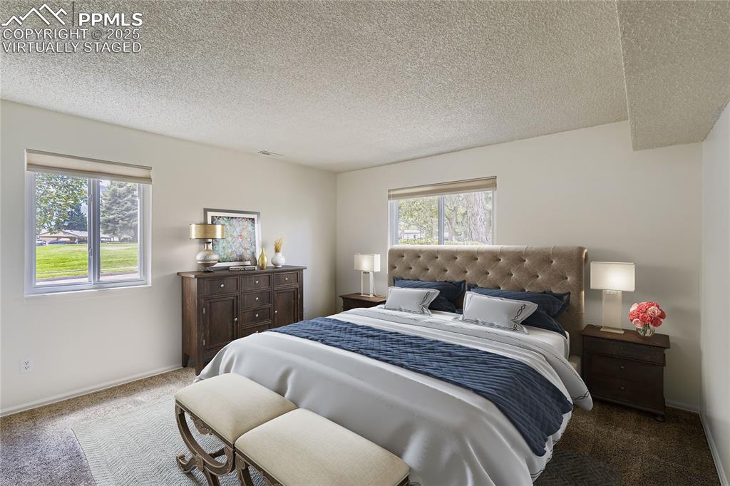 850 Tenderfoot Hill Road, Unit 103 Colorado Springs, CO 80906 - Photo 3 of 20 a bedroom with a bed and a window