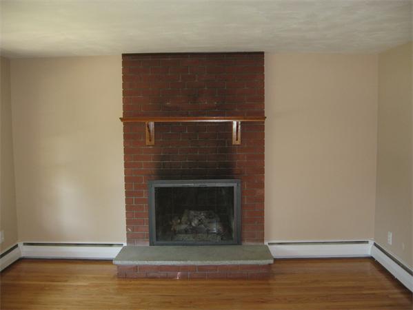 12 Westminster Road Billerica, MA 01821 - Photo 3 of 10 a living room with a fireplace