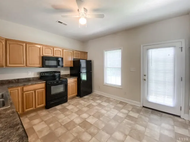 a kitchen with a stove a sink and a refrigerator